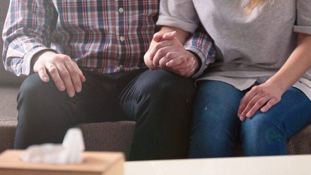 Couple holding hands