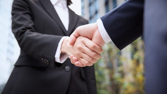 Two people shaking hands